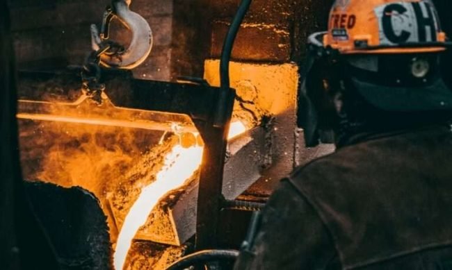 vertical-shot-adult-industrial-worker-uniforms-melting-metal-factory